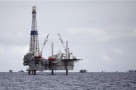 A view of a drilling rig and distant production platform in the Soldado Field off Trinidad's southwest coast, September 10, 2011. REUTERS/Andrea De Silva